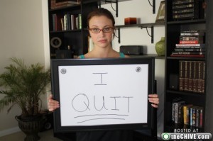 Dispirited Employee Makes Sign Saying "I Quit!"